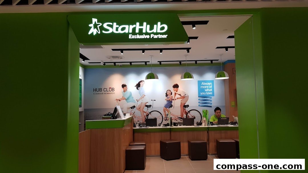 The entrance to a StarHub Exclusive Partner shop with a bright green facade and interior.