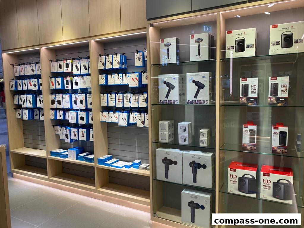 A retail shop displaying various electronic accessories and gadgets on shelves and in display cases.