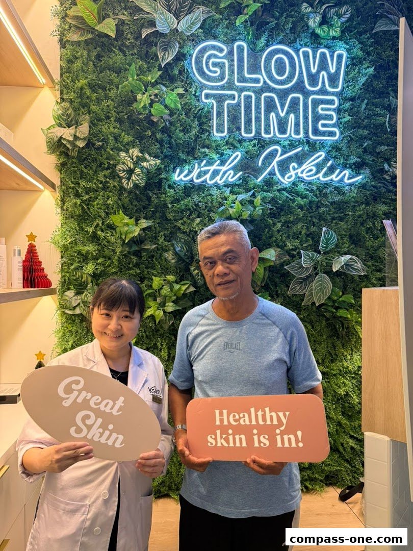 A skincare professional and a client pose with signs promoting great and healthy skin.