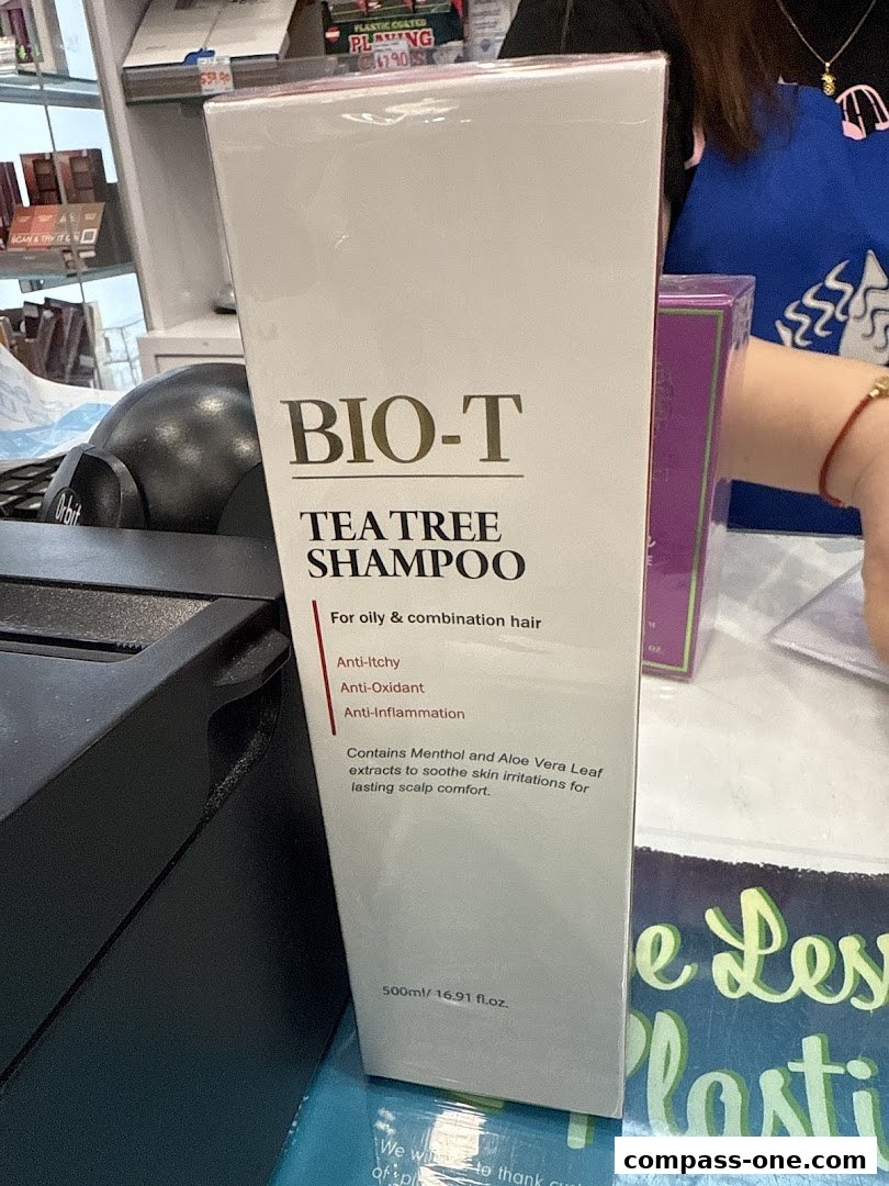 A box of BIO-T Tea Tree Shampoo is displayed at a counter.