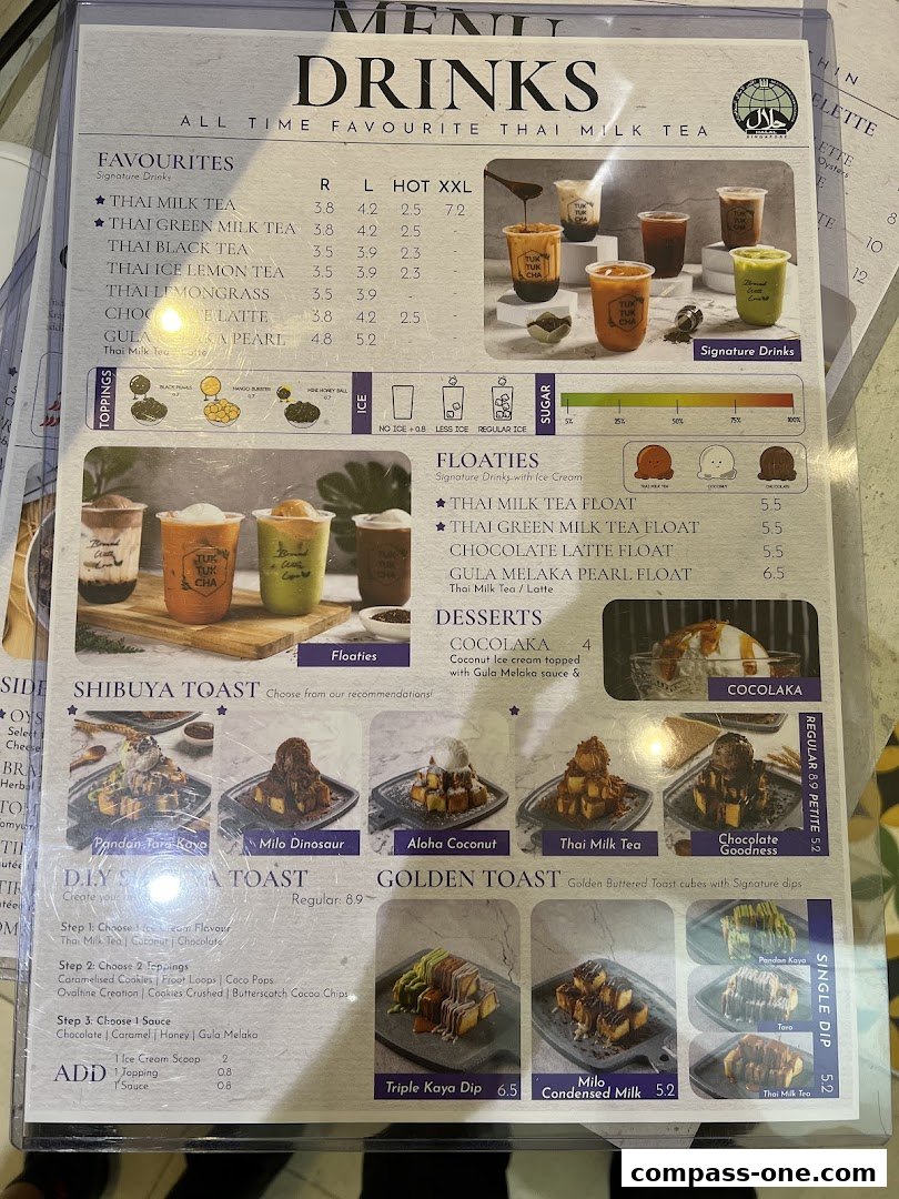 A menu for Tuk Tuk Cha Treasures featuring drinks, desserts, and toast options.