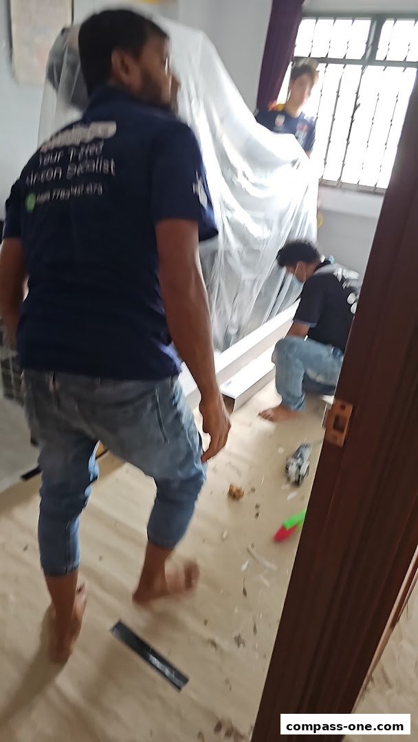 Technicians working on an air conditioning unit installation or maintenance.