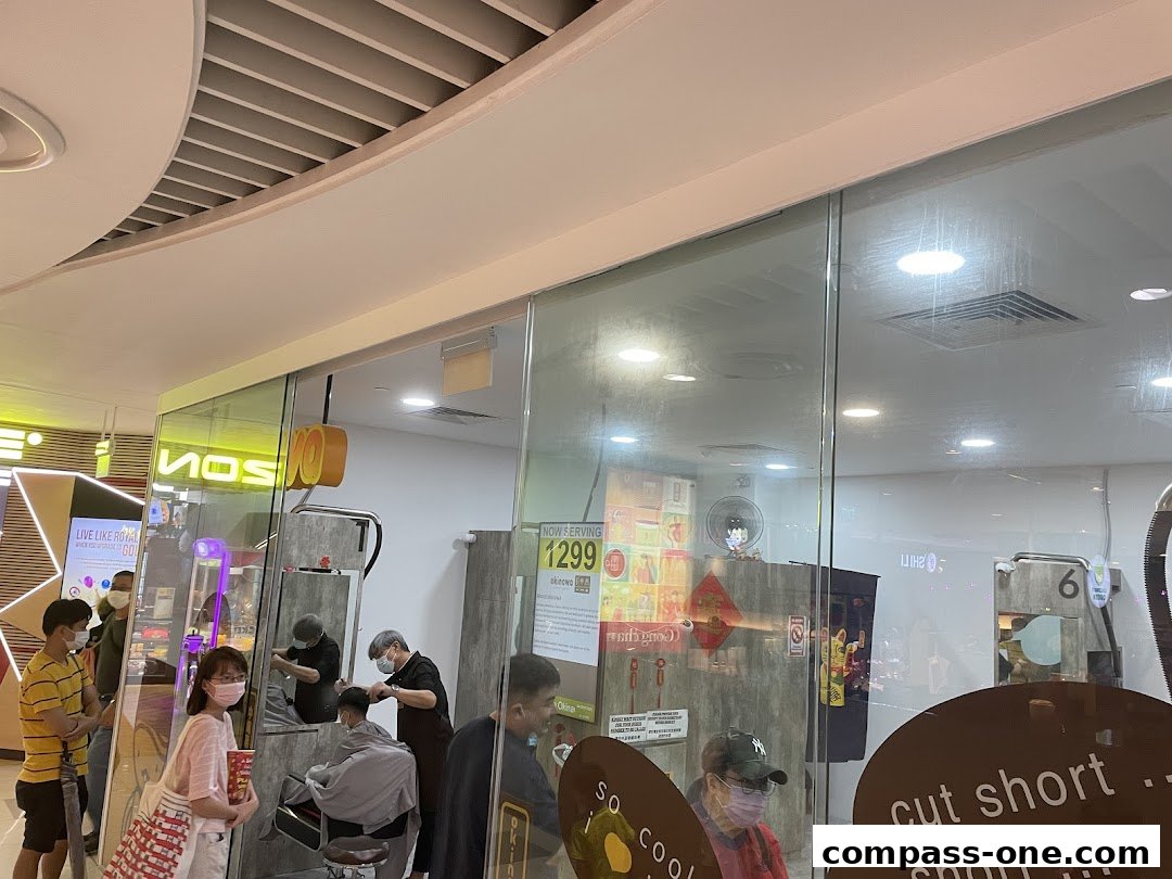 Okinawa Hair Salon interior with customers and stylists visible through the glass.