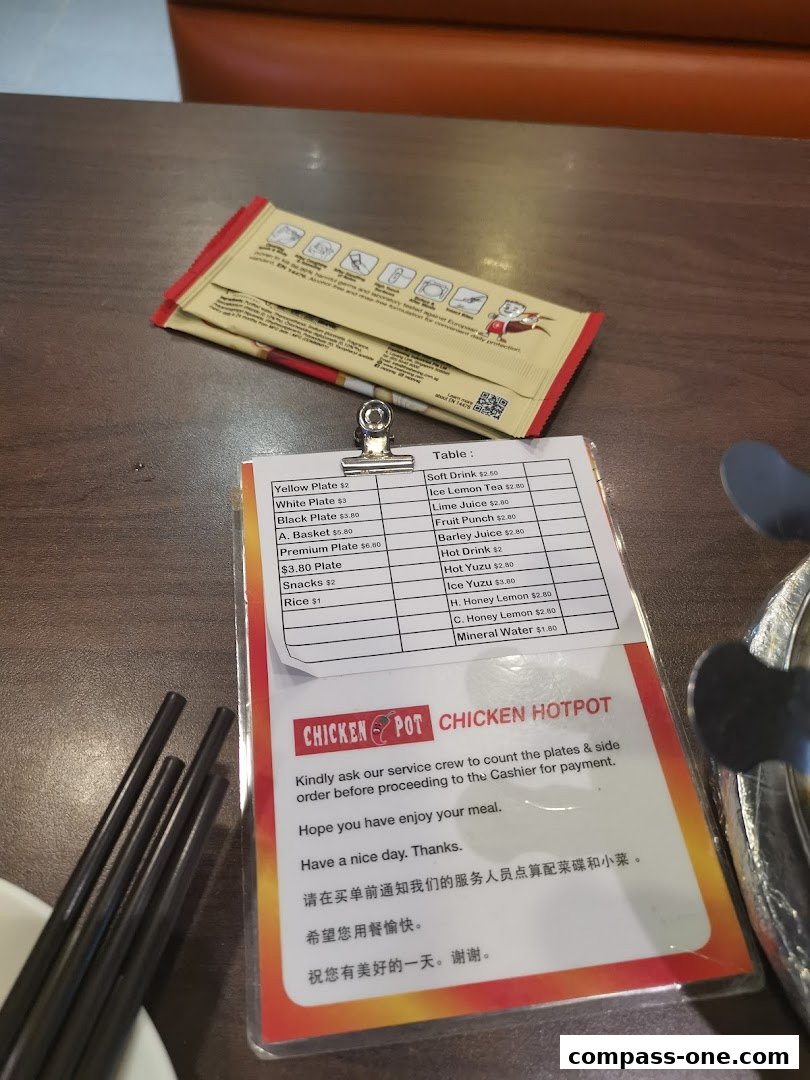 A menu from Chicken Hotpot with various plates, snacks, drinks, and hotpot items.