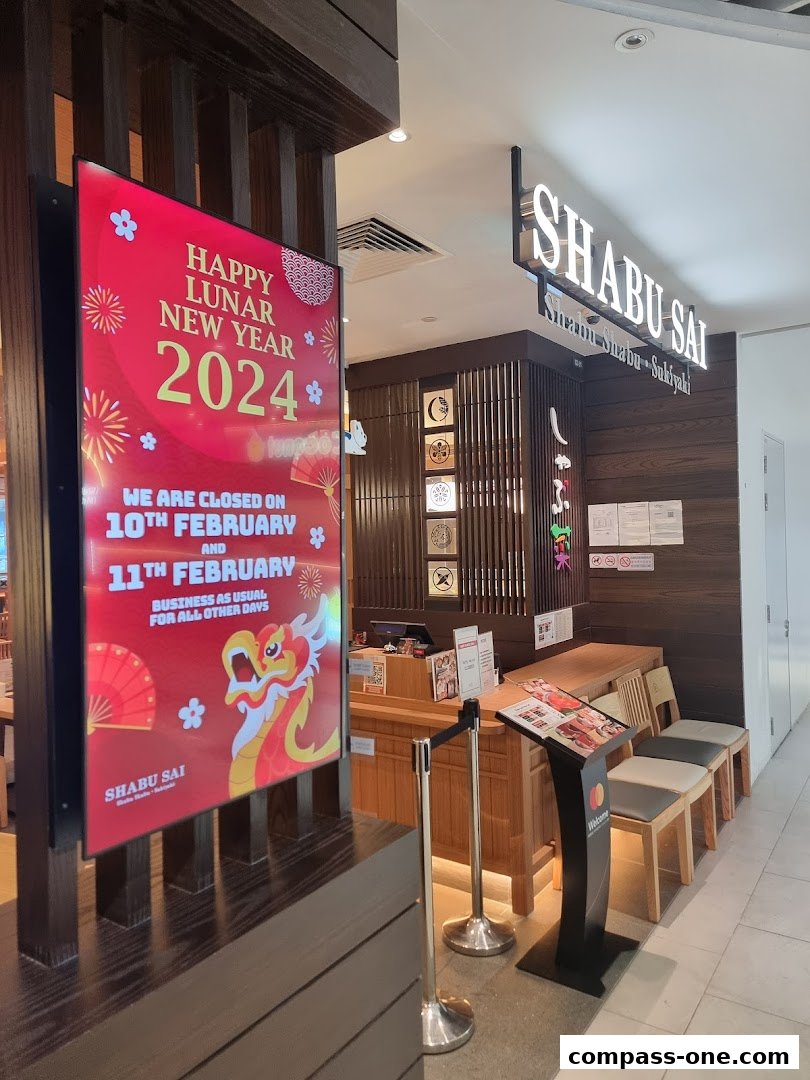 Shabu Sai restaurant entrance with Lunar New Year decorations and closure notice.