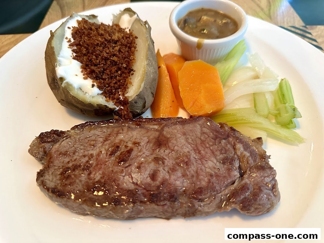 A juicy steak served with a baked potato, vegetables, and mushroom sauce.