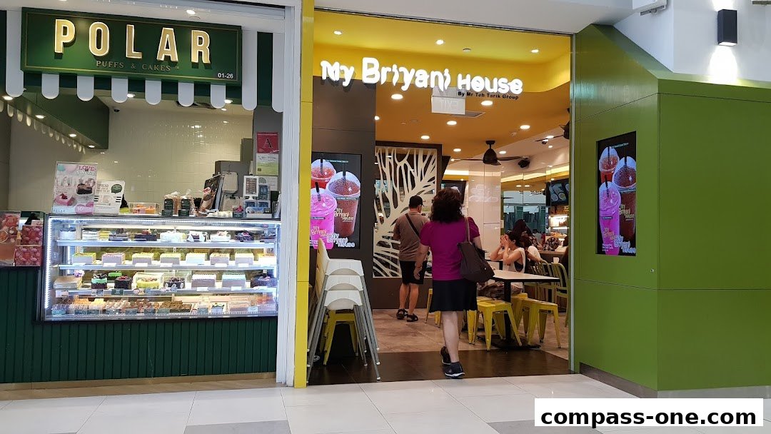 A view of Polar Puffs & Cakes and My Biryani House shops in a mall.