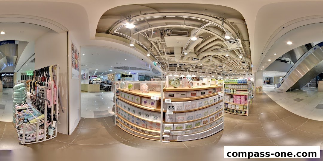 Interior view of a MINISO store showcasing shelves filled with various products like clocks and fans.