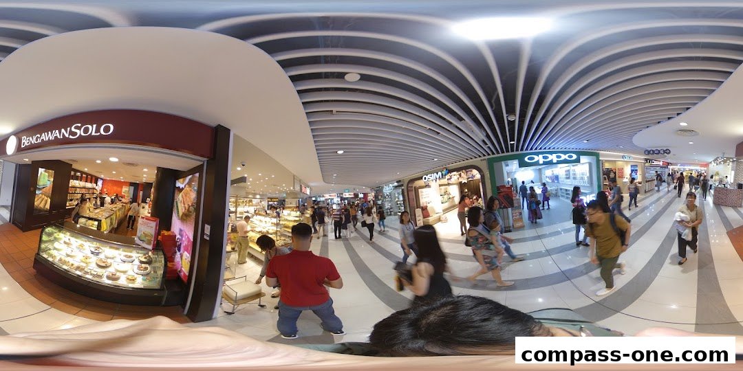 The entrance of Bengawan Solo, a bakery, with display cases filled with pastries and cakes.