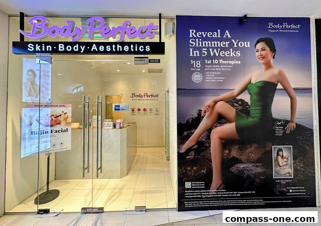 The entrance of Body Perfect, a skin, body, and aesthetics clinic, with promotional posters.