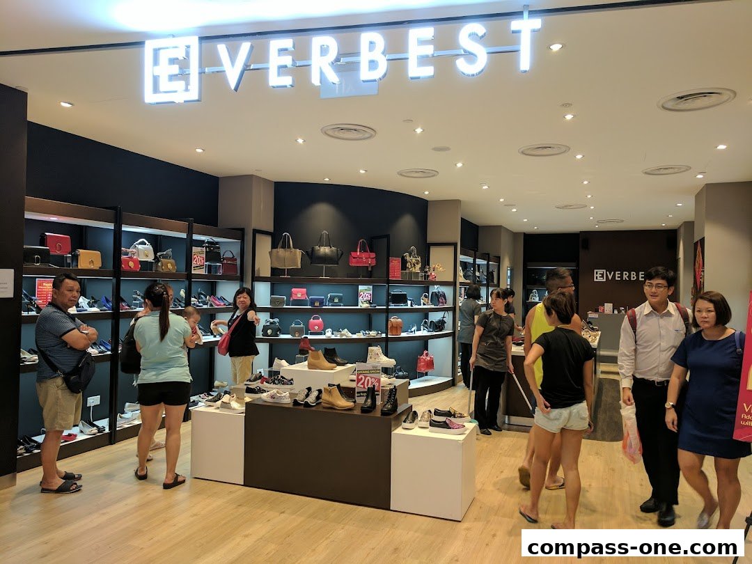 Customers browsing shoes and handbags inside the Everbest store.