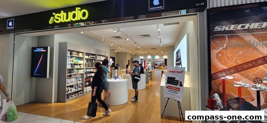 The iStudio store, a premium Apple reseller, showcasing Apple products and a Christmas sale.