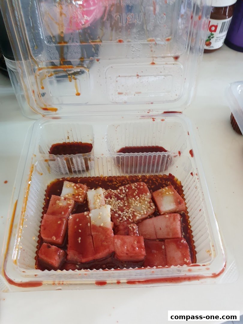 A takeaway container filled with Jian Bo Shui Kueh, a traditional dessert.