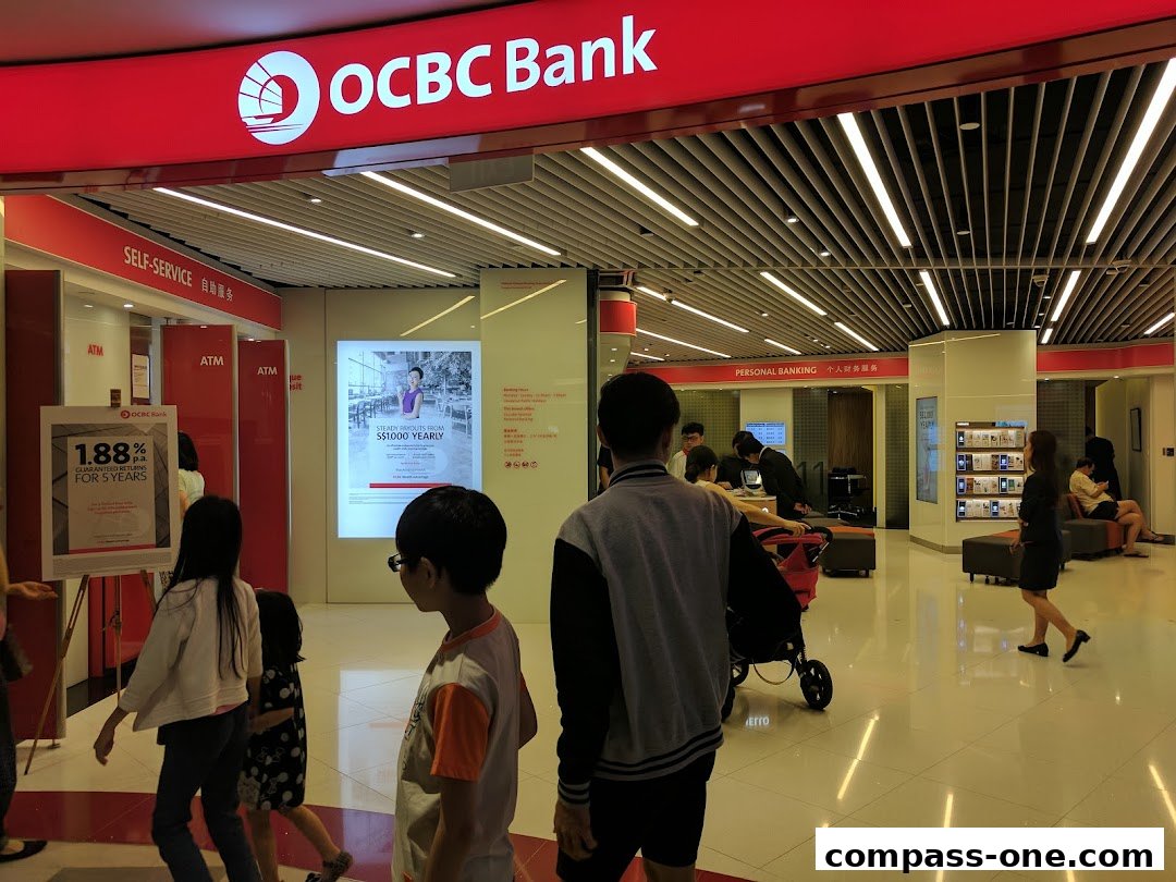 The entrance of an OCBC Bank branch with self-service ATMs and personal banking areas.