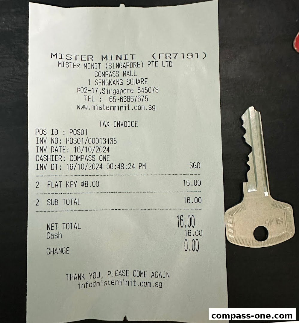 A receipt from Mister Minit showing a purchase of two flat keys, with a key next to it.