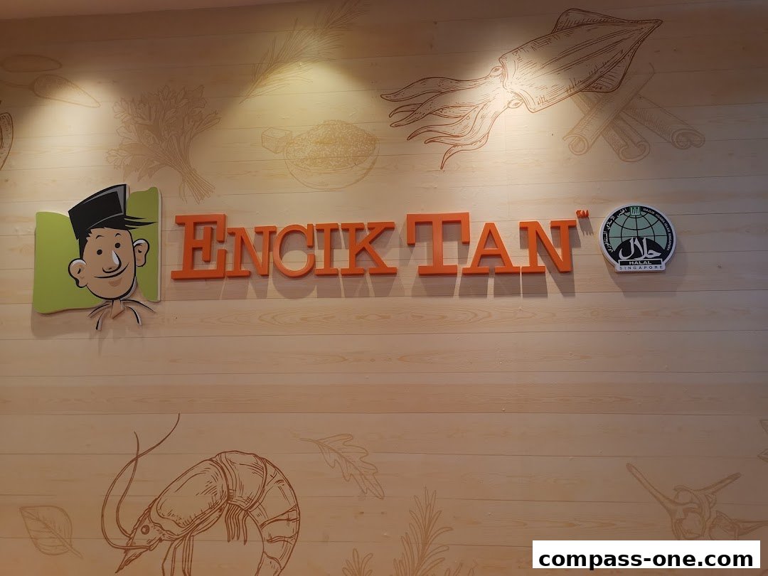 The Encik Tan logo with a cartoon character and Halal certification.