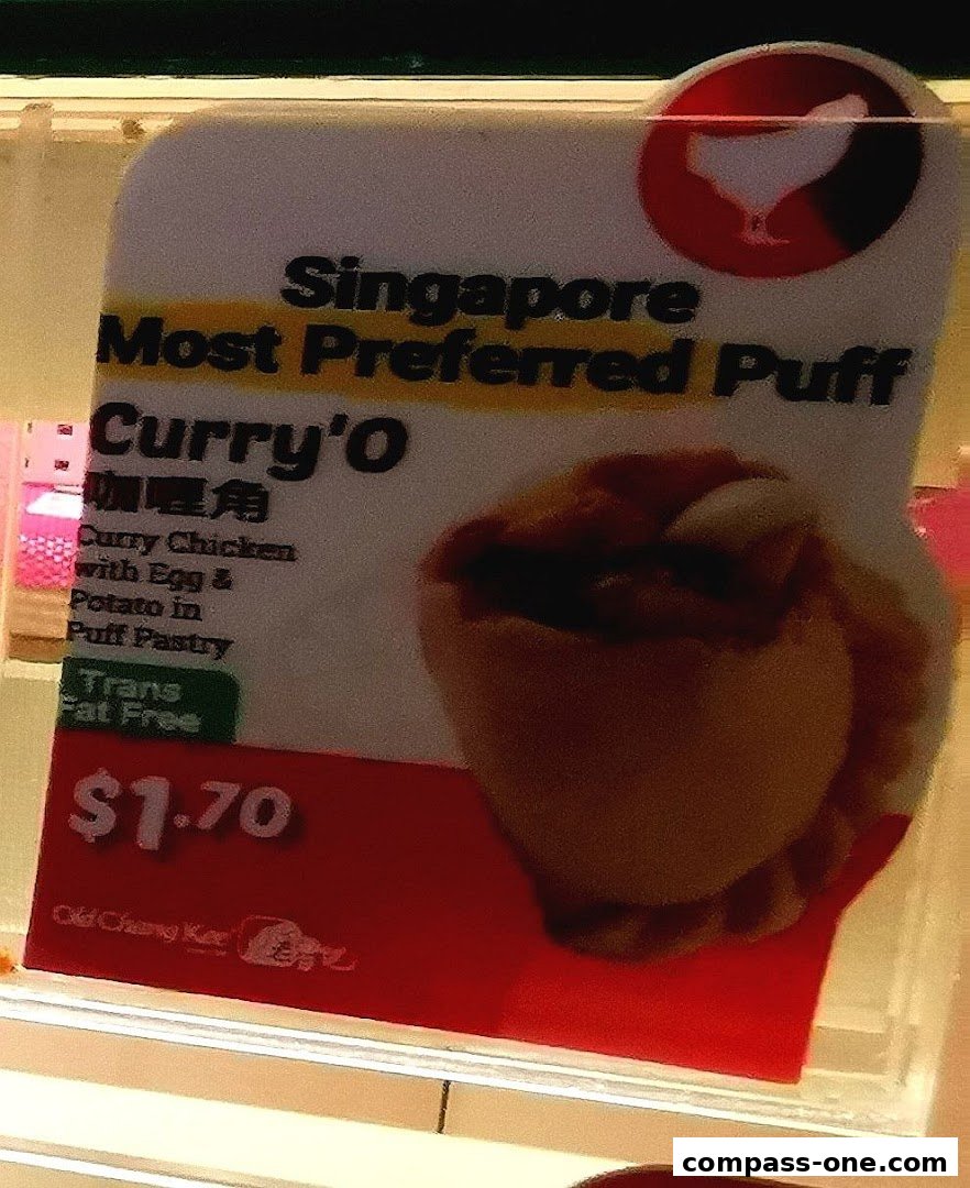 A sign advertising Old Chang Kee's Curry'O puff, highlighting it as Singapore's most preferred.