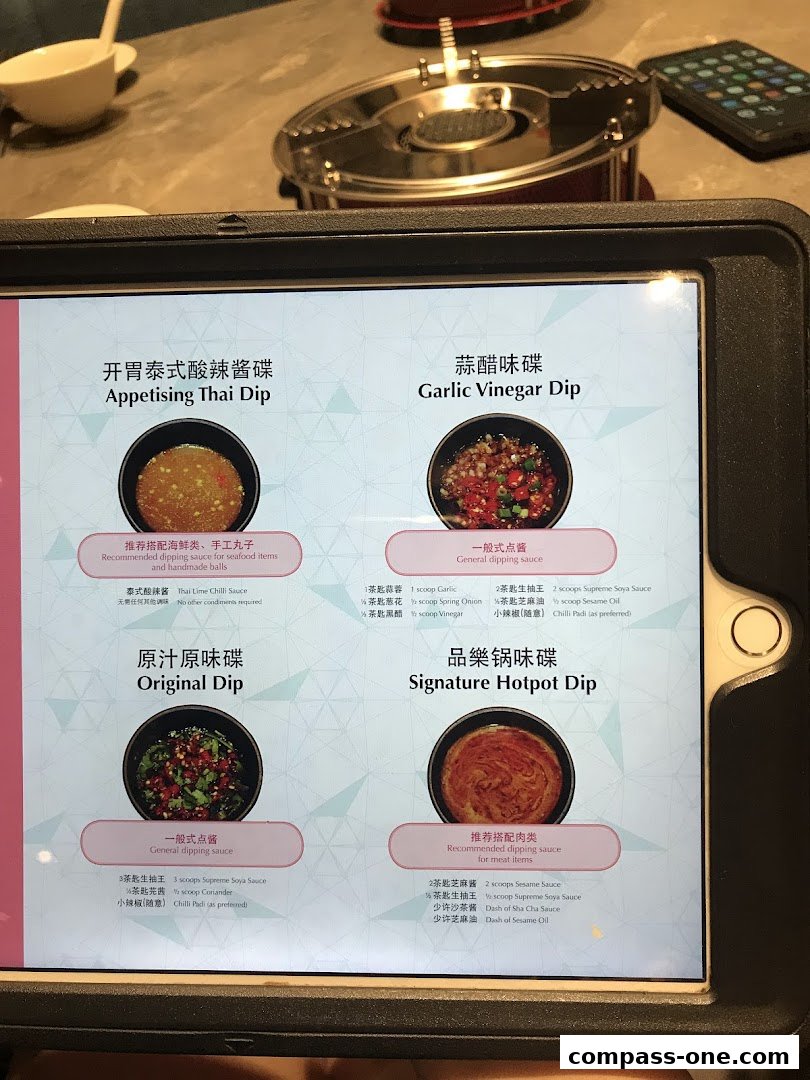 A tablet displays a menu with four different hotpot dipping sauces.