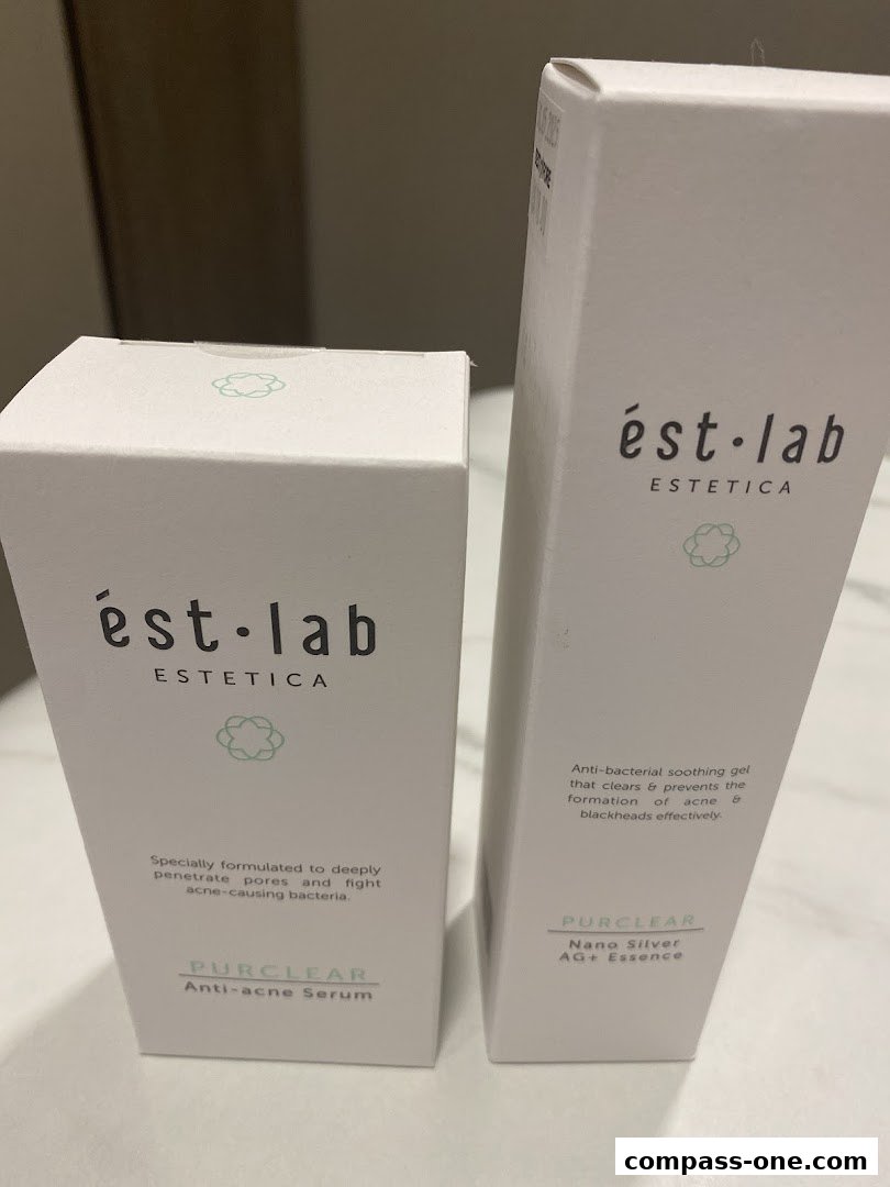 Two Estetica Beauty skincare product boxes, one serum and one essence.