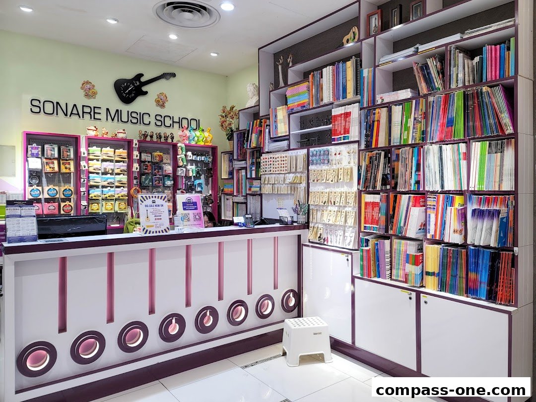 Interior of Sonare Music School with a counter, shelves of books, and music accessories.