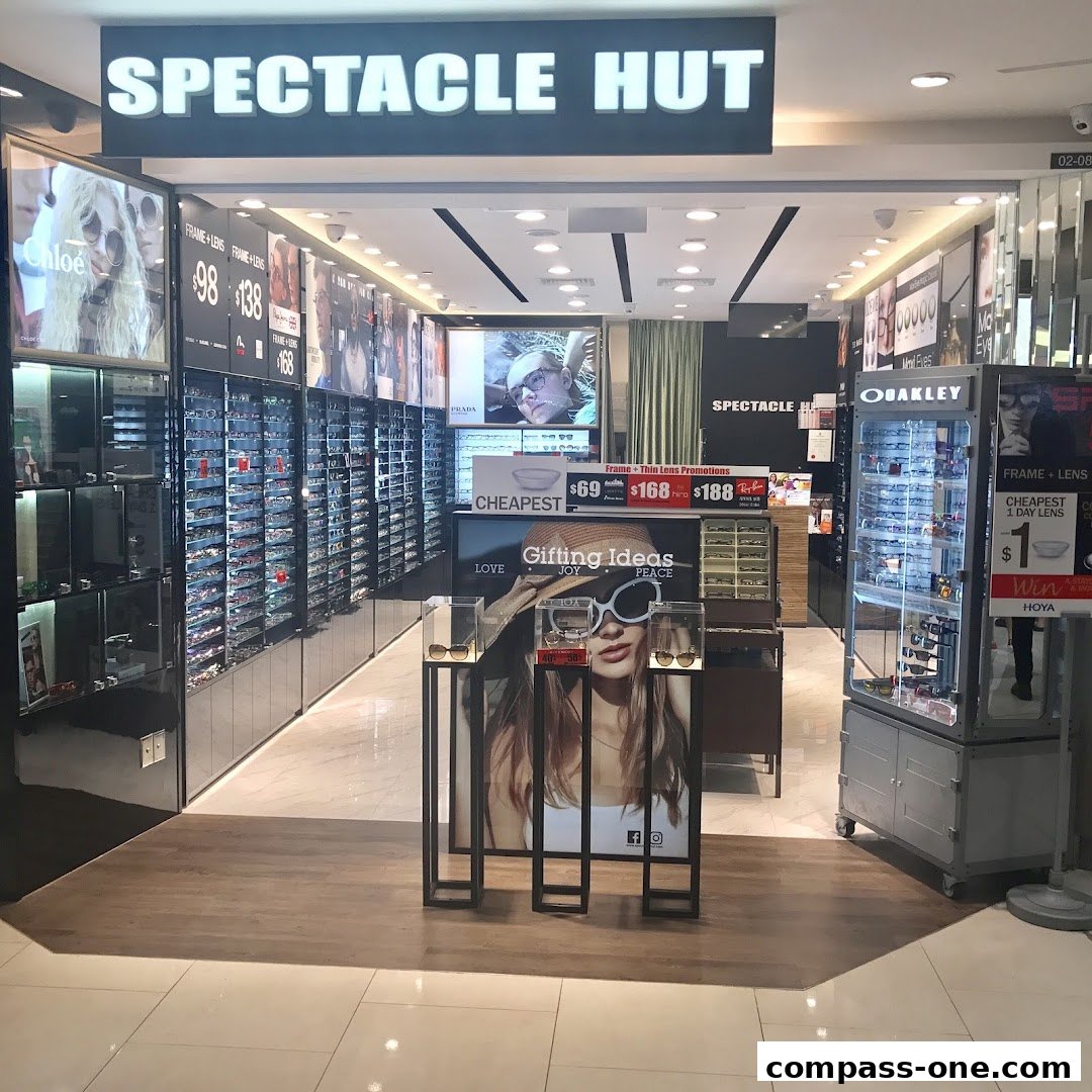 The entrance of Spectacle Hut, showcasing a wide selection of eyewear and promotional displays.