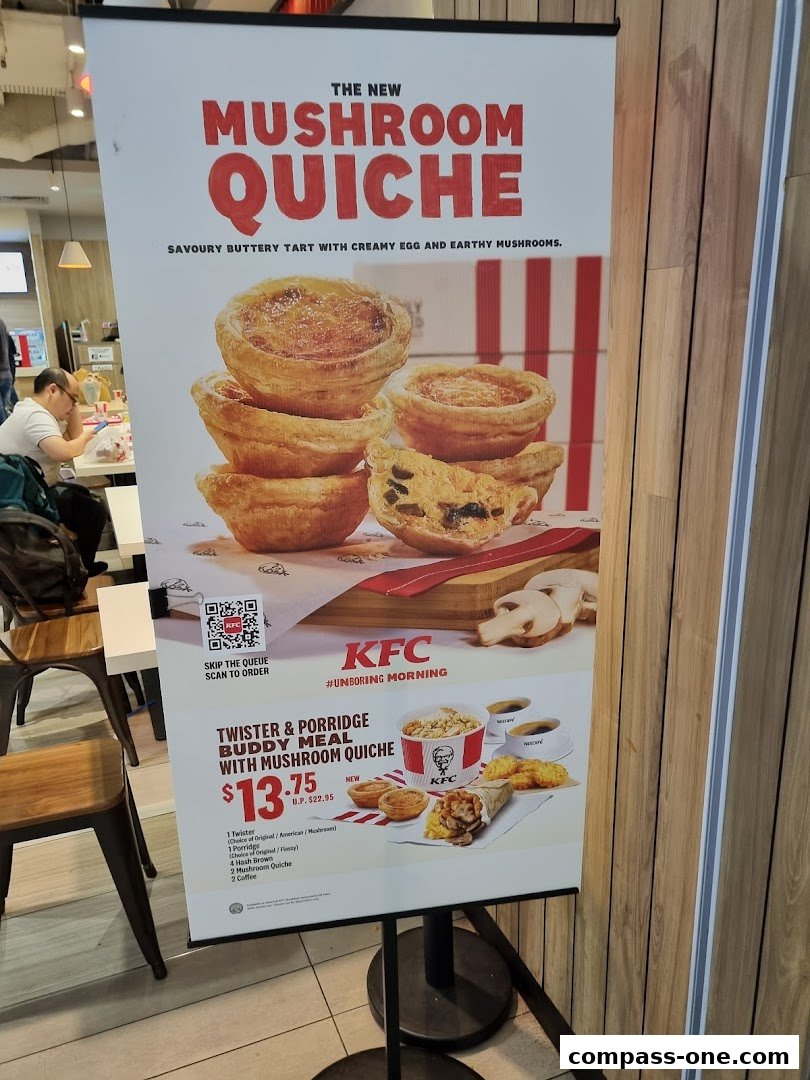A promotional banner for KFC's new Mushroom Quiche and a Buddy Meal.