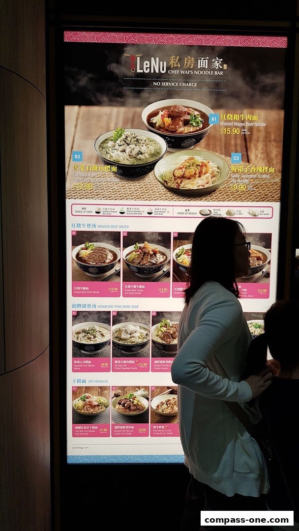 A menu board for LeNu Chef Wai's Noodle Bar, showcasing various noodle dishes with prices.