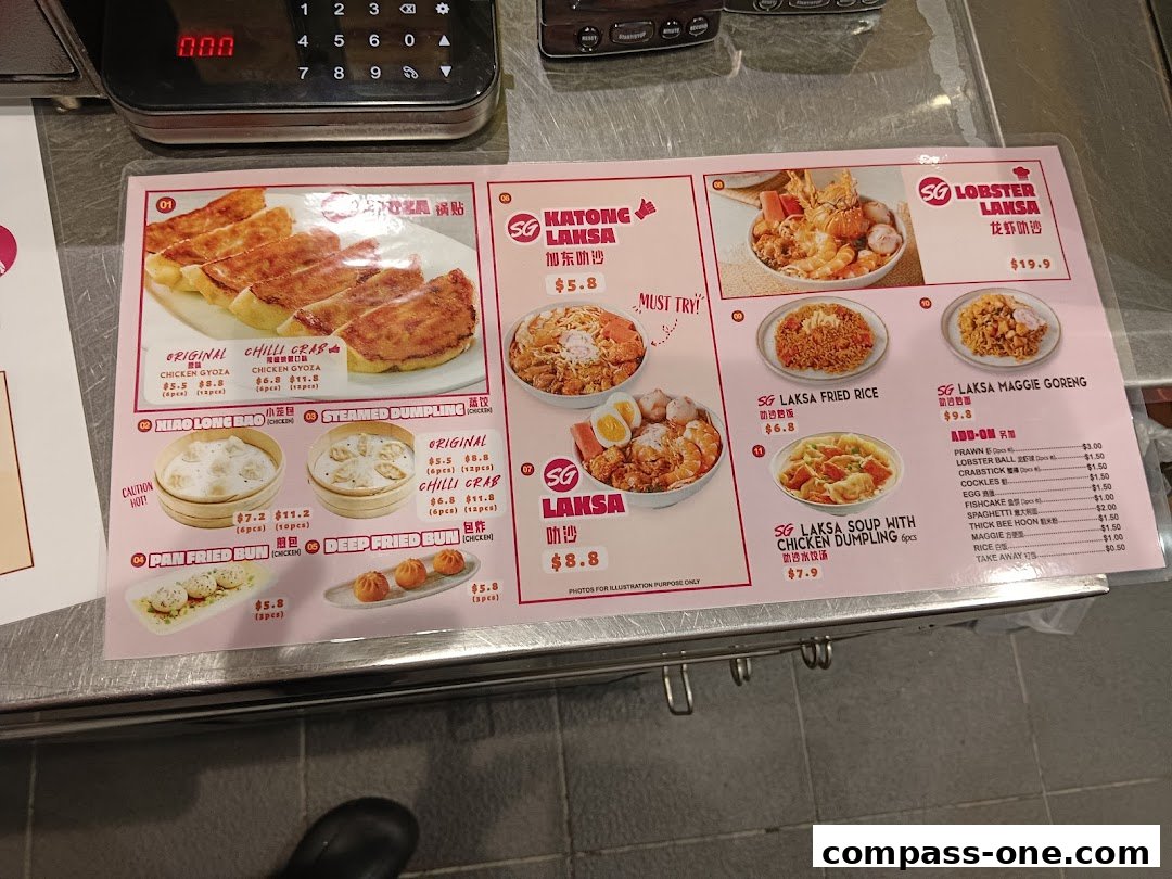 A menu from Kopitiam featuring various noodle dishes, dumplings, and fried items with prices.