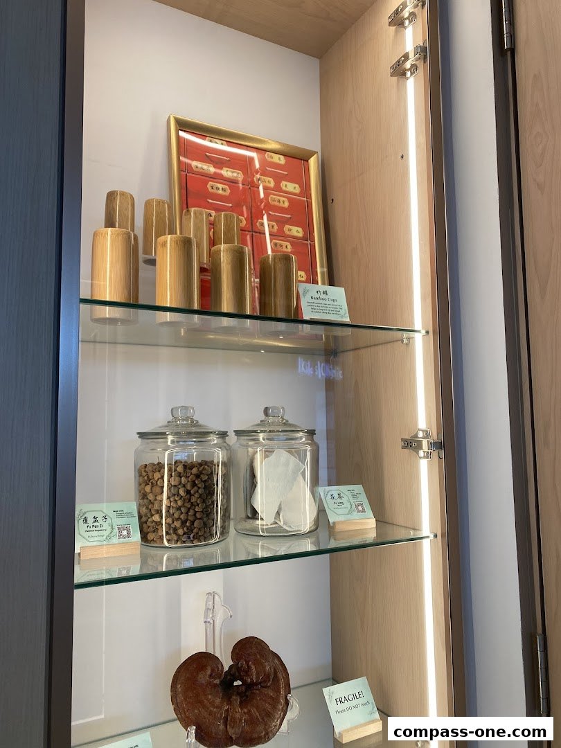 A display cabinet showcasing traditional Chinese medicine ingredients and products.