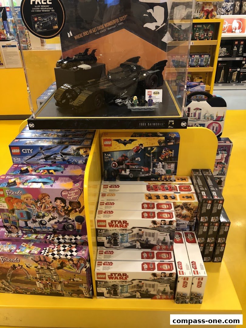 Display of LEGO sets including Batman, City, Friends, and Star Wars themes.