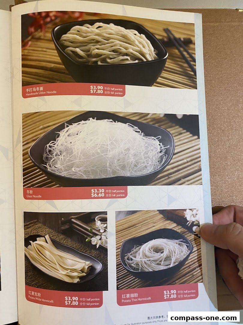 A menu page showcasing various noodle dishes with prices and portion sizes.