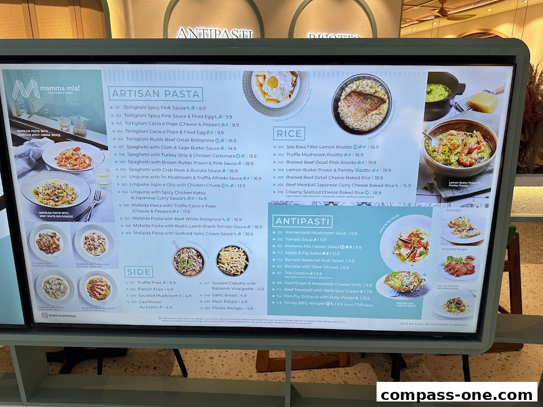 A digital menu board displaying various Italian pasta, rice, antipasti, and side dishes with prices.