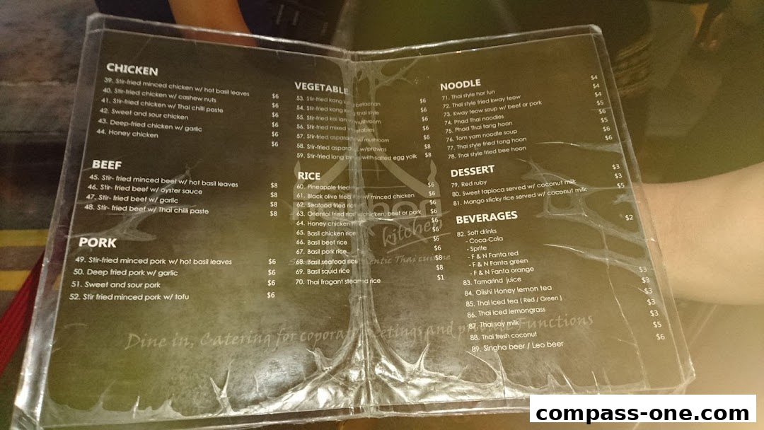 A menu from Nakhon Kitchen featuring Thai cuisine, including chicken, beef, pork, vegetables, rice, noodles, desserts, and beverages.