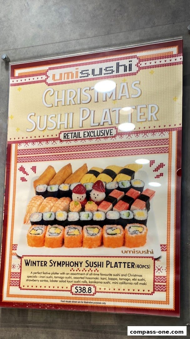 A Christmas-themed sushi platter with various sushi types and festive decorations.