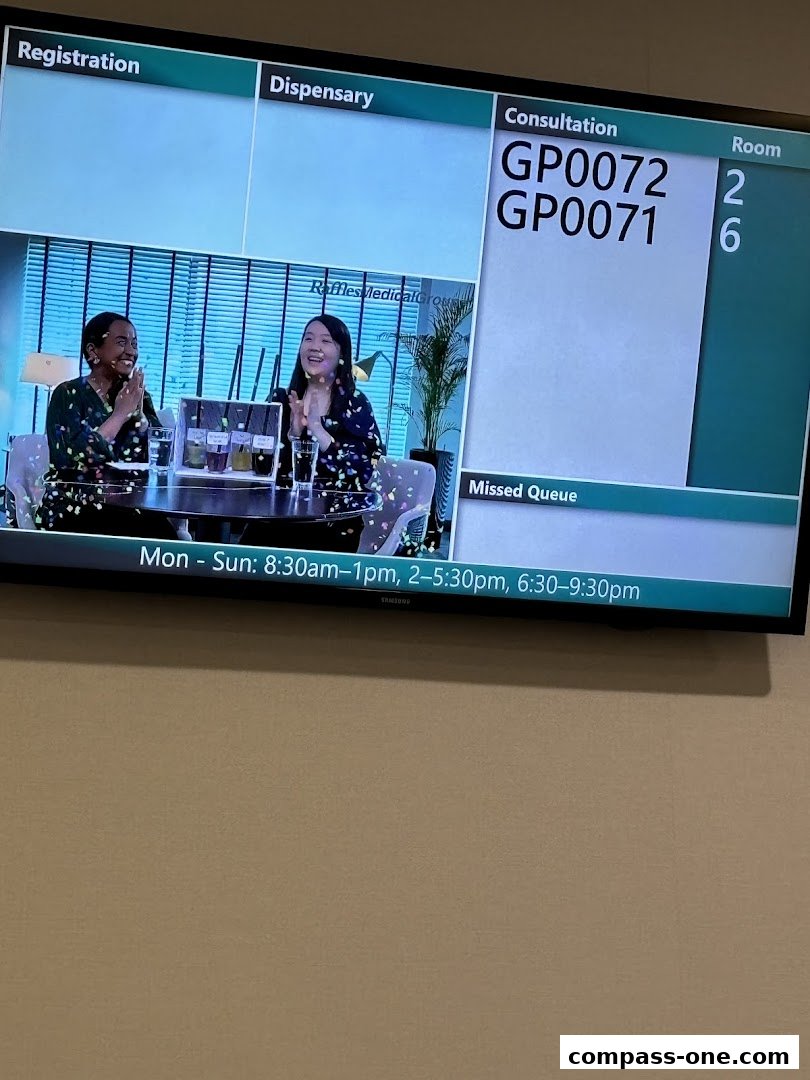 A screen displays queue numbers for consultation and operating hours for Raffles Medical.