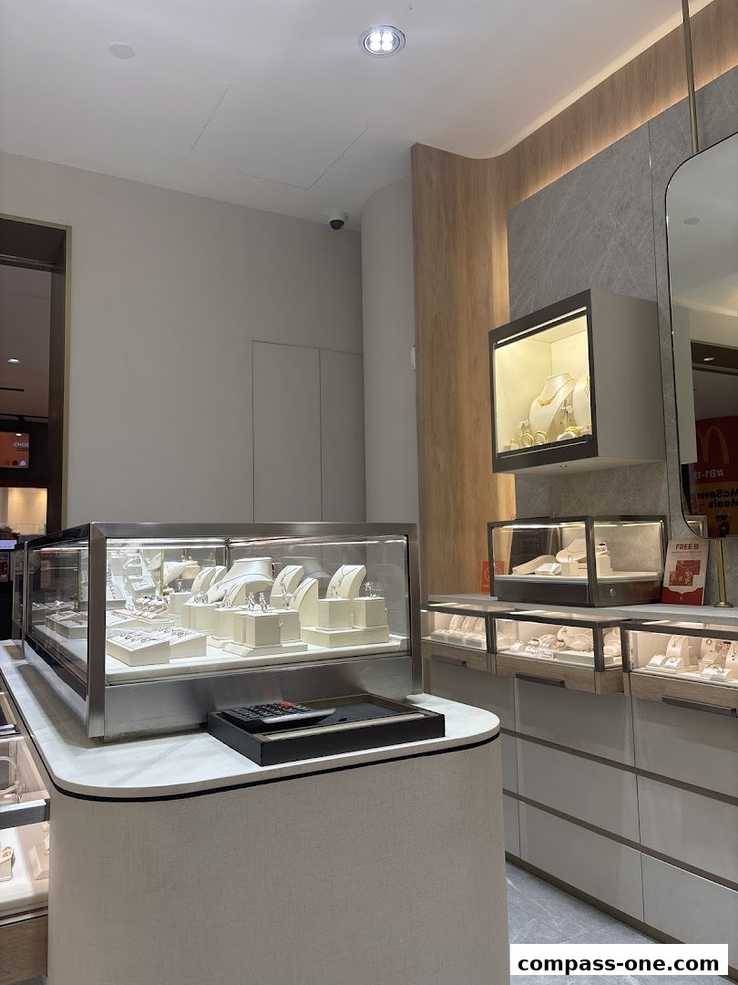 Interior view of a jewelry store with display cases filled with necklaces and rings.