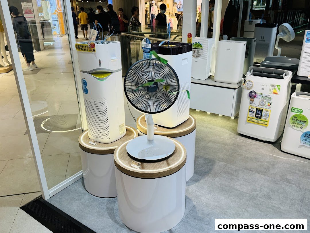 A display of various air purifiers and fans in a retail store.