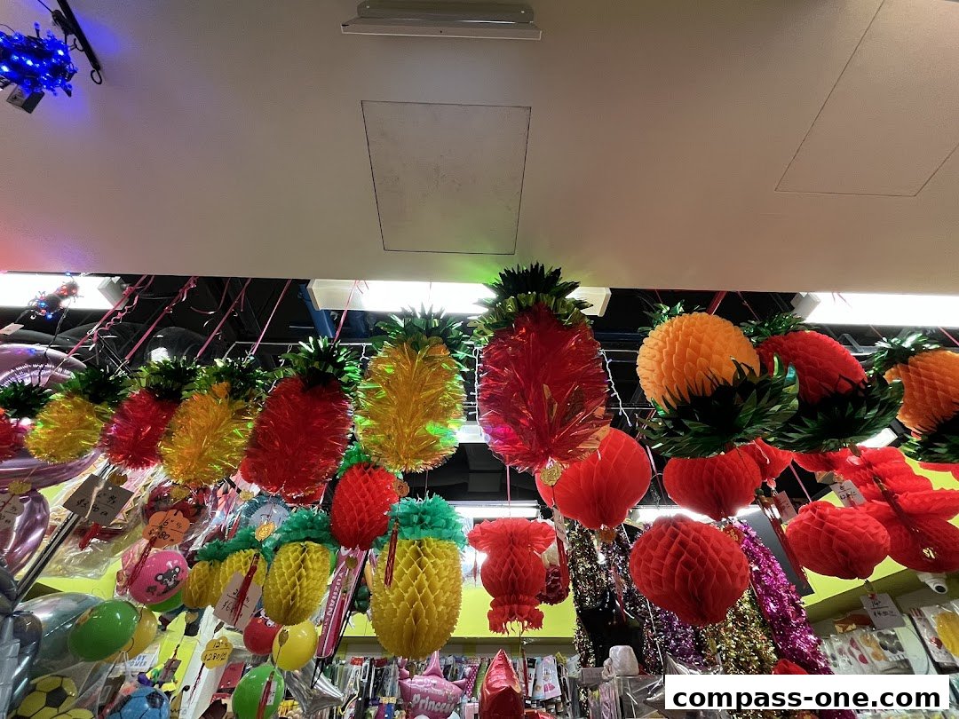 A shop interior filled with colorful pineapple-shaped decorations and party supplies.