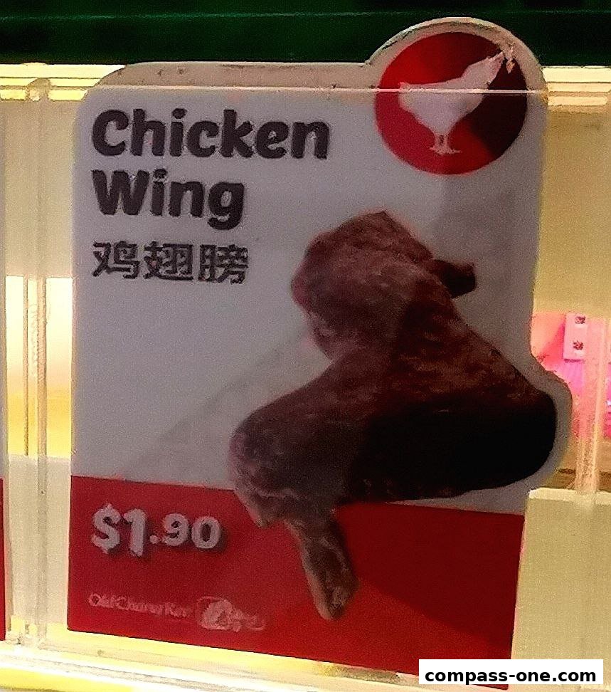 A sign displaying a chicken wing with its price and Chinese characters.