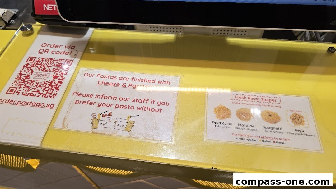 A counter display shows ordering instructions, pasta finishing options, and fresh pasta shapes.