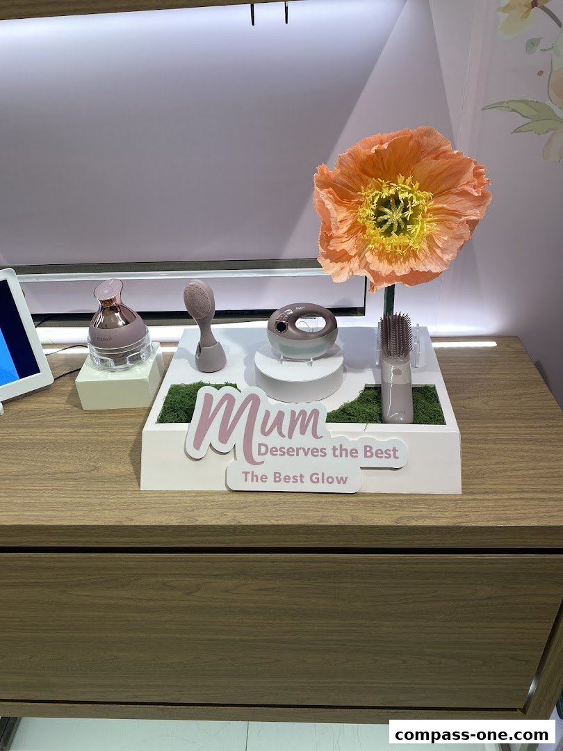 OSIM products displayed with a large orange flower and a 'Mum Deserves the Best' sign.