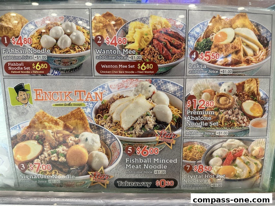A menu board displaying various noodle dishes and sets from Encik Tan.