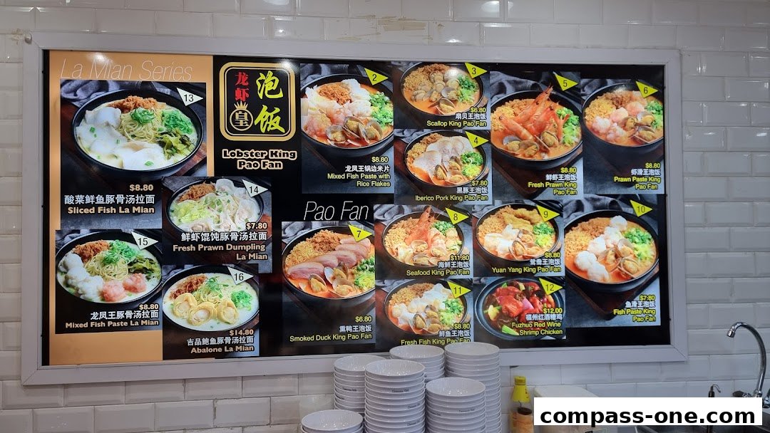 A menu board displaying various Pao Fan and La Mian dishes with prices and images.