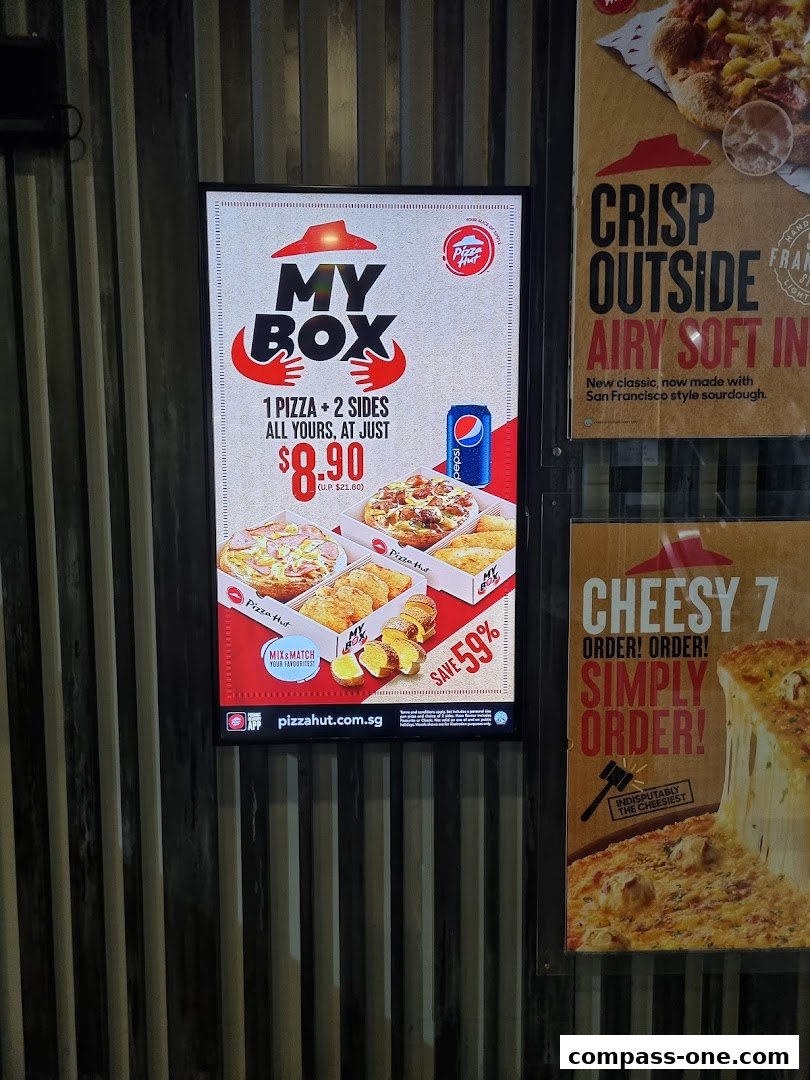 A Pizza Hut advertisement showcasing the 'My Box' meal deal with pizza, sides, and a drink.
