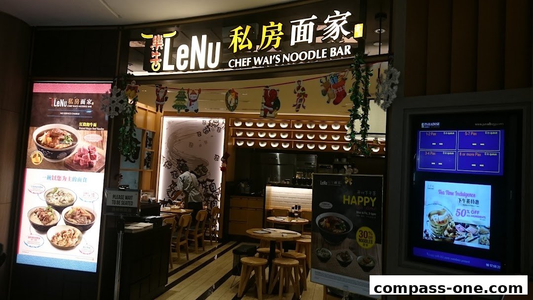 LeNu Chef Wai's Noodle Bar storefront with festive decorations and illuminated displays.