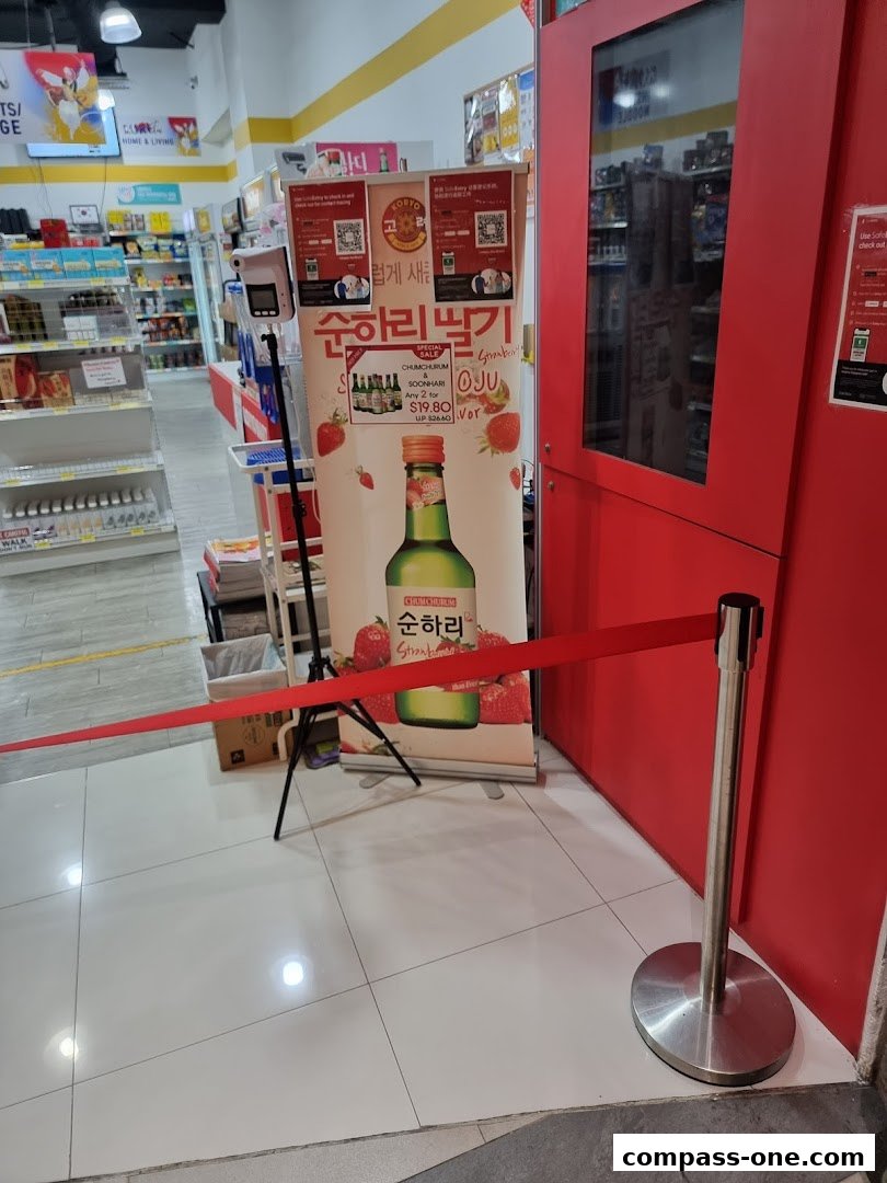Koryo Mart Compass One entrance with a promotional banner for Soju.