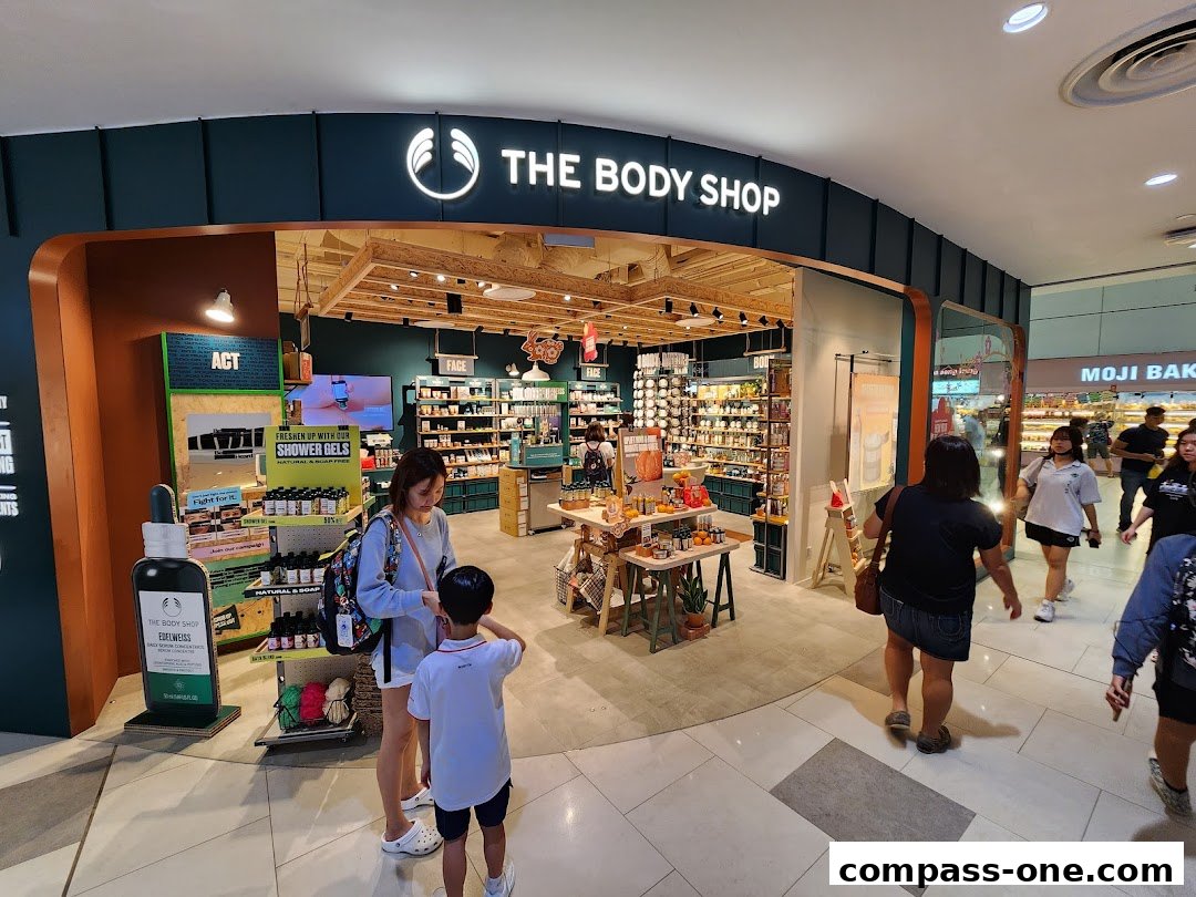 The Body Shop store entrance with customers browsing products and displays.