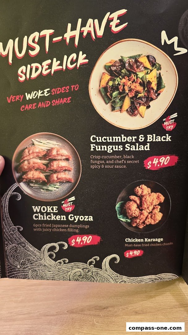 A menu showcasing WOKE Chicken Gyoza, Cucumber & Black Fungus Salad, and Chicken Karaage.
