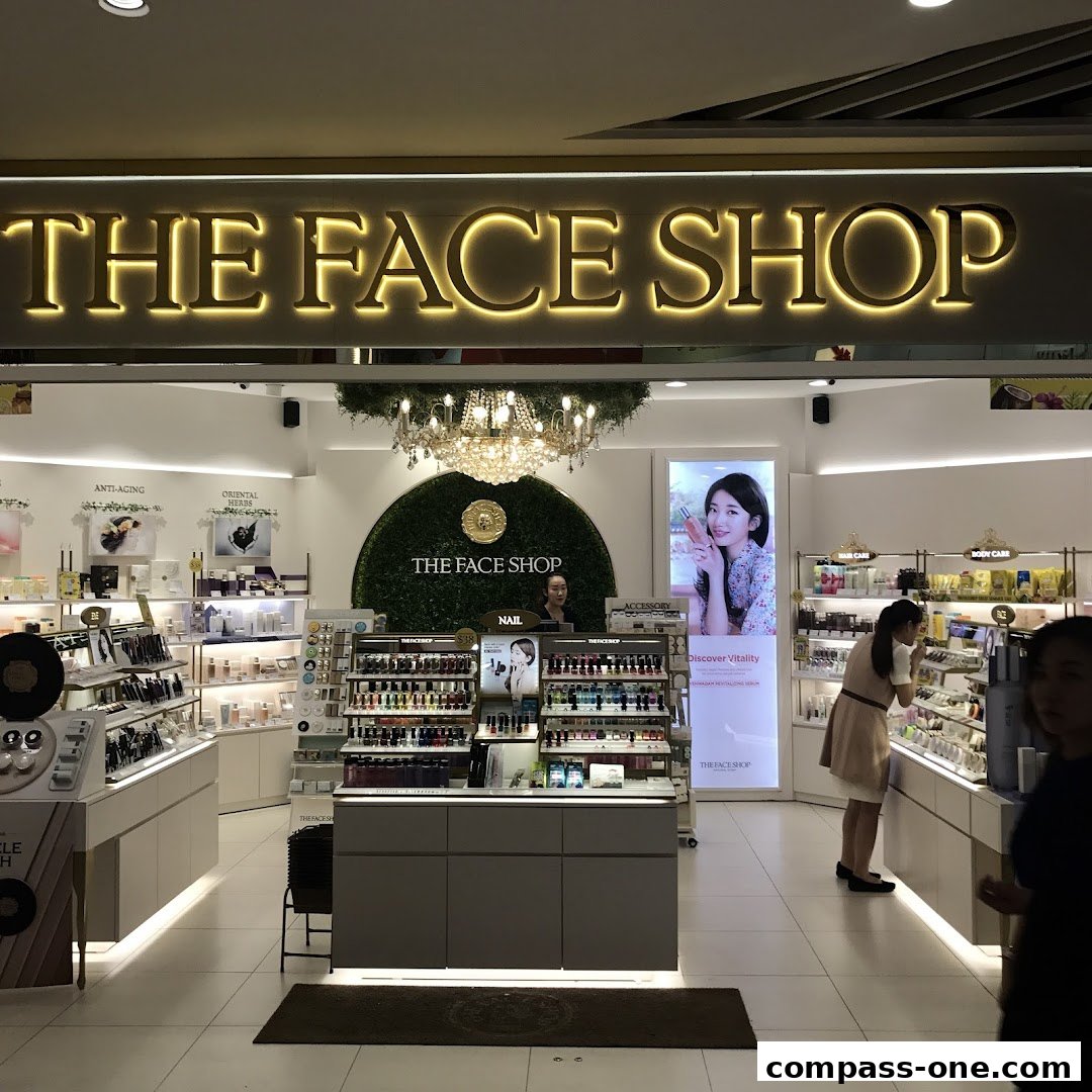 The interior of The Face Shop, showcasing beauty products and a promotional display.
