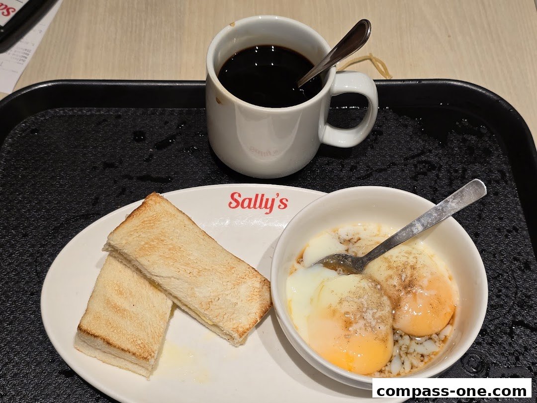 A breakfast set from Sally's featuring soft-boiled eggs, toast, and coffee.